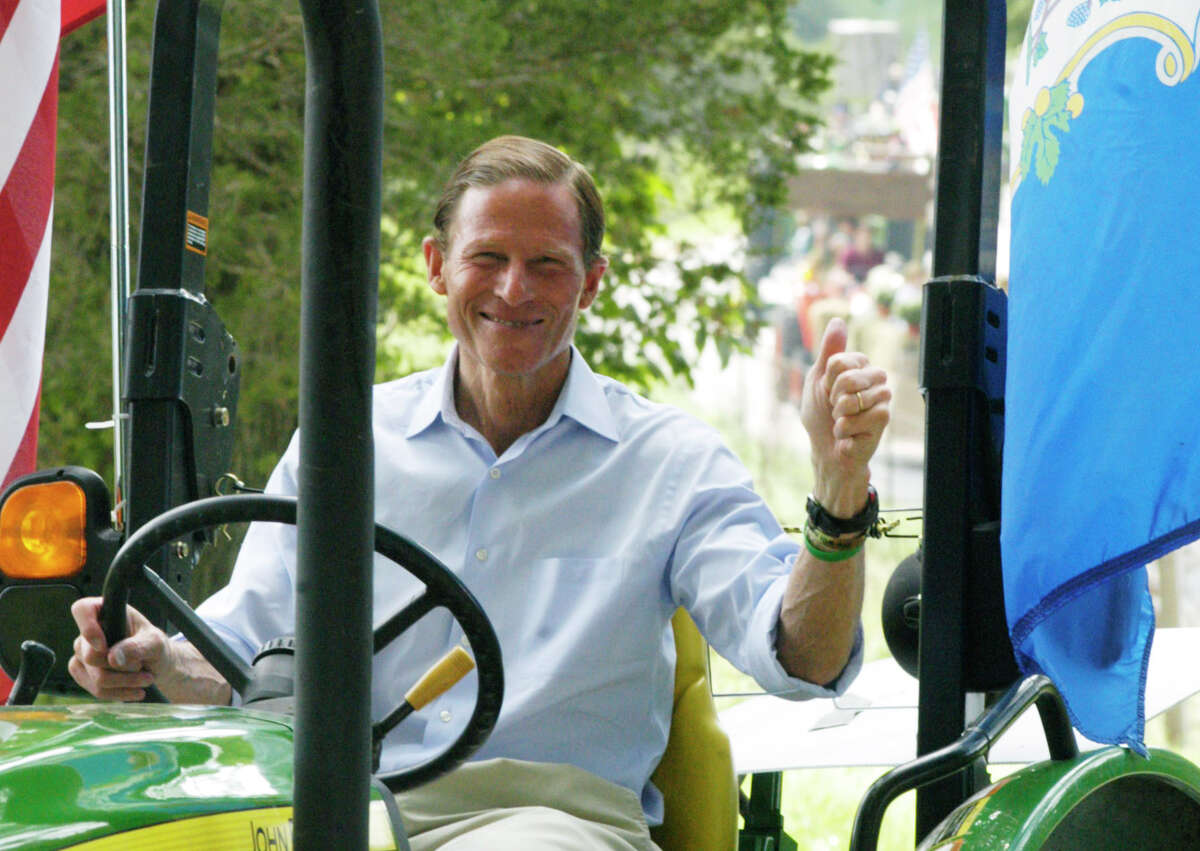U.S. Sen. Richard Blumenthal is clearly pleased to be back in town to enjoy Bridgewater's annual tractor parade, Sunday, Aug. 31, 2014