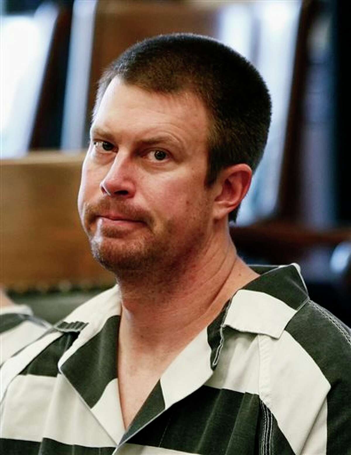 FILE - In this May 8, 2012, file photo, former NFL quarterback Ryan Leaf, center, sits in a Cascade County courtroom in Great Falls, Mont. Leaf has been sentenced to five years in prison in Texas for violating terms of his probation, Tuesday, Sept. 9, 2014. (AP Photo/The Great Falls Tribune, Larry Beckner, File) NO SALES