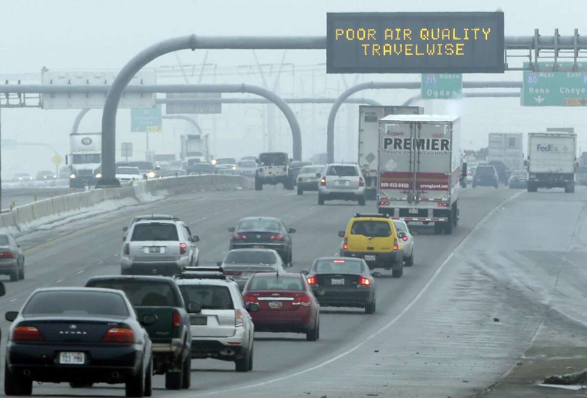 FILE - This Jan. 23, 2013, file photo, shows a poor air quality sign is posted over a highway, in Salt Lake City. Carbon dioxide levels in the atmosphere reached a record high in 2013 as increasing levels of man-made pollution transform the planet, the U.N. weather agency said Tuesday, Sept. 9, 2014. (AP Photo/Rick Bowmer, File)