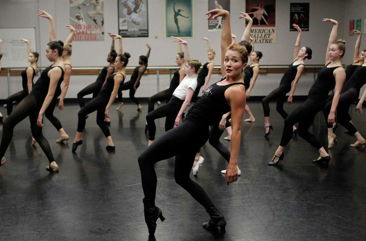 Students learn from The Radio City Rockettes, Jessica Osborne, as she teaches one of two master classes at The High School for the Performing and Visual Arts (HSPVA) on Tuesday, Sept. 9, 2014, in Houston.
