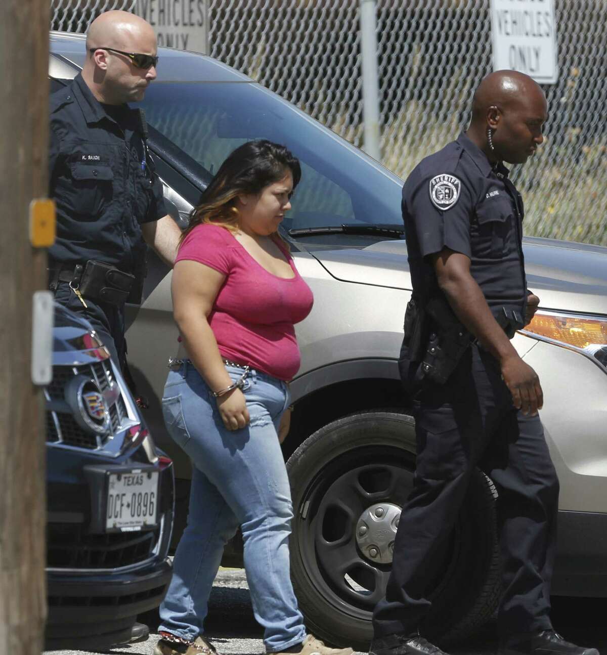 Selena Amanda Huitron, 17, is escorted by Bexar deputies. She faces three counts of aggravated assault of a public servant and one count of evading arrest with a motor vehicle.