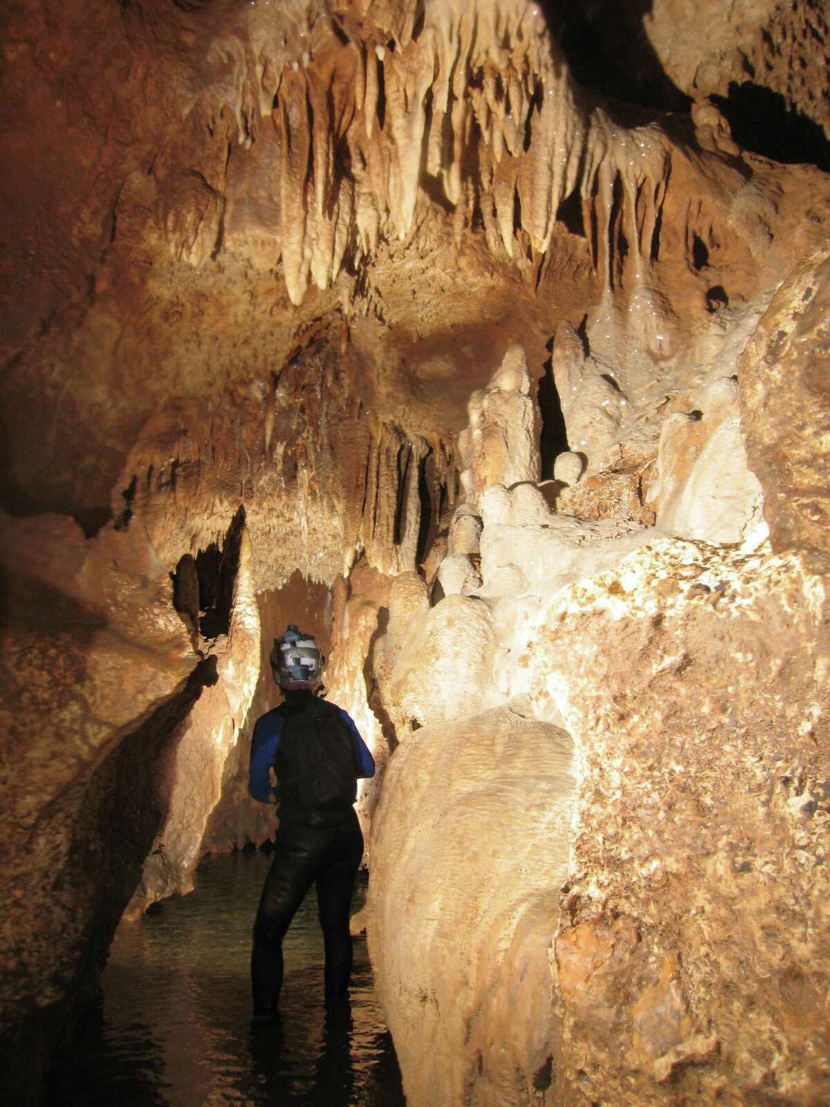Honey Creek Cave is the longest known cave in Texas, stretching more than 20 miles. It is continuously "growing" because cavers are still exploring the huge underground formation and it is a tributary of the Guadalupe River.