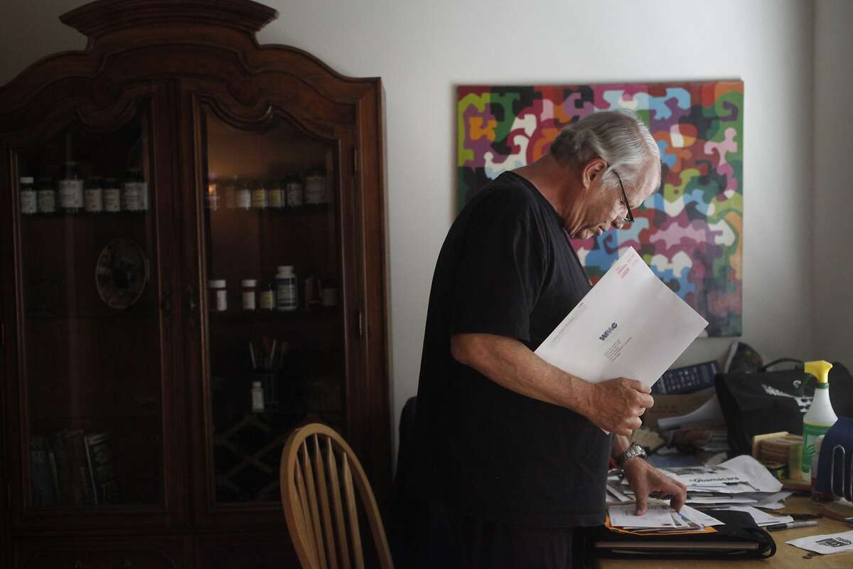 Barry Melton, 67, goes through his mail at his home Sept. 10, 2014 in Sacramento, Calif. This Saturday night Melton and his band will be playing at The Saloon in North Beach for the last time after 32 years of playing the venue.