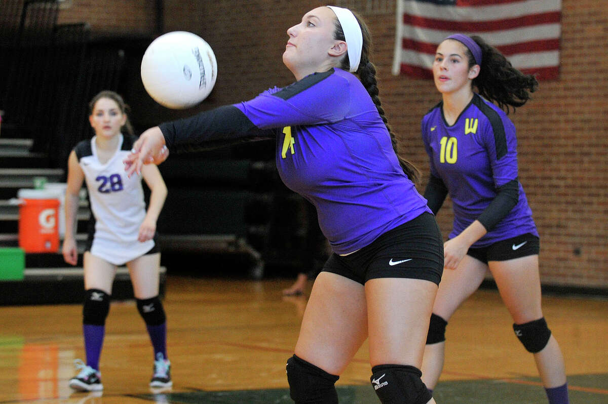 Westhill's Jessica Mezias connects with the ball during the Vikings' volleyball match against Trinity Catholic at Trinity Catholic High School in Stamford, Conn., on Wednesday, Sept. 10, 2014. Westhill won, 3-1.