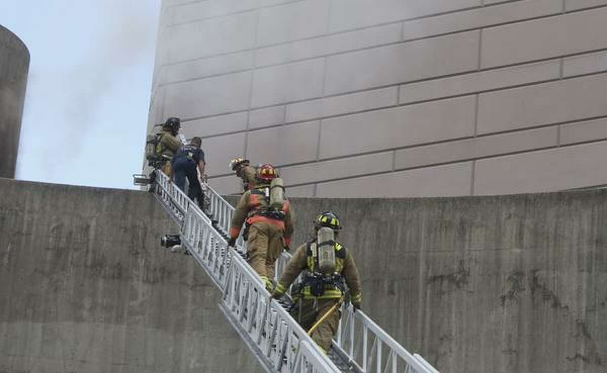 Houston firefighters respond to a fire at the Alley Theater at Louisiana and Texas in downtown.