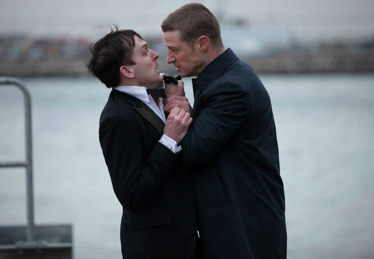 Detective Jim Gordon (Ben McKenzie) gets rough with the soon-to-be Penguin (Robin Lord Taylor).