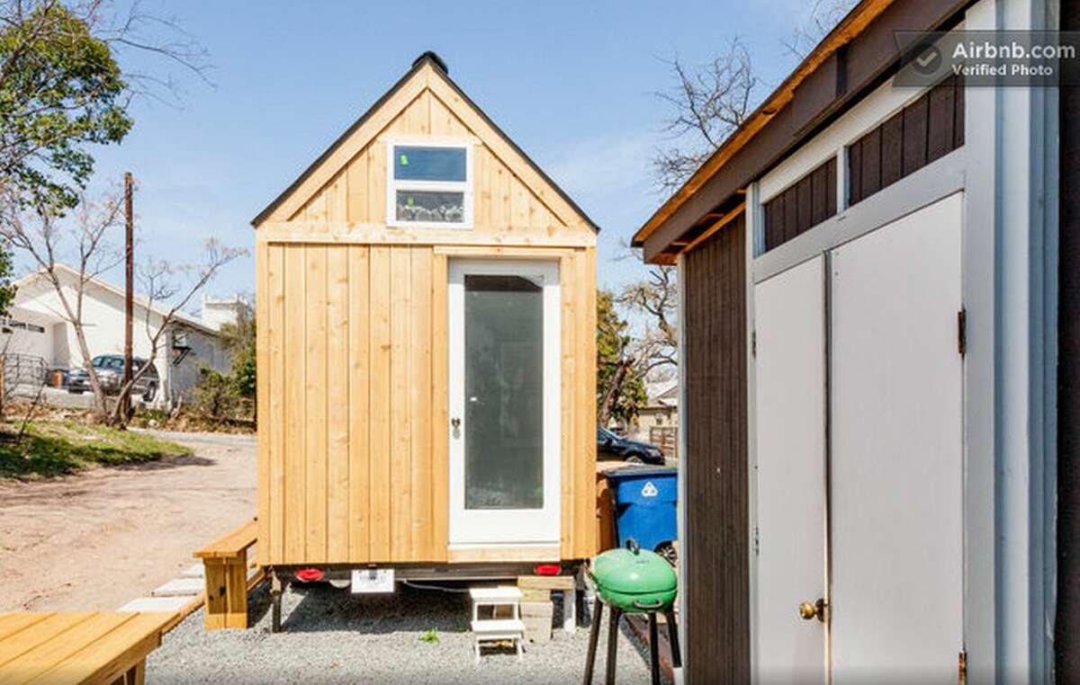 Austin - Texas tiny house The 8-foot by 12-foot space comes with a downstairs living room and a loft with a queen-sized bed for $69 per night.