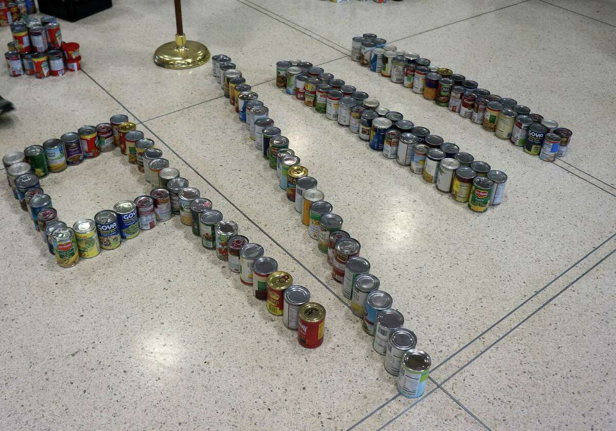 Greenwich High School students made a 9/11 tribute made of food cans in the student center during the school's One-for-One on Nine-One-One food drive.