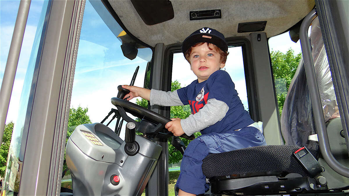 Michael Rodriguez of Fairfield, got right into the cab of a front loader at last year's Touch-A-Truck event sponsored by the Junior Women's Club of Fairfield. This year's heavy-vehicle fest is planned for Sunday, Sept. 21 with trucks, music, food and other attractions at Fairfield Ludlowe High School.