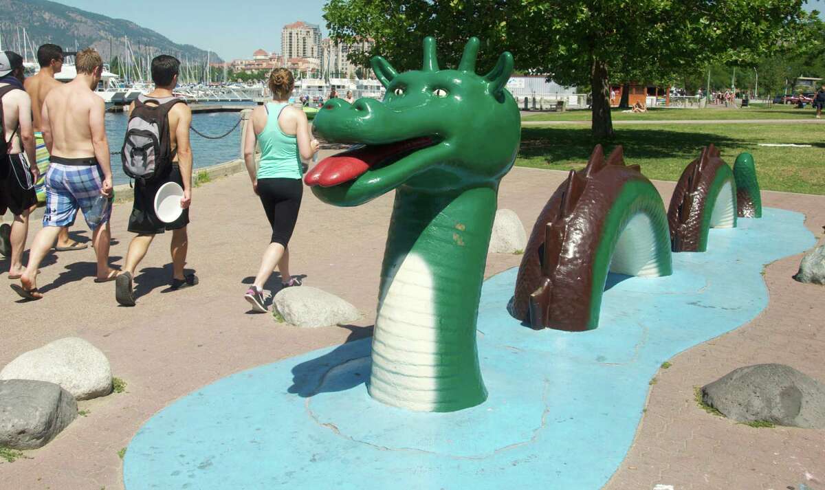 Lake Okanagan (above) may harbor a mysterious creature, as re-created in a lakefront statue (below). Or does it?