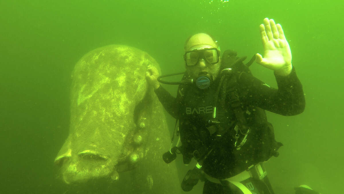 Author John Flinn with Ogopogo statue, 25 feet beneath the surface of Okanagan Lake.