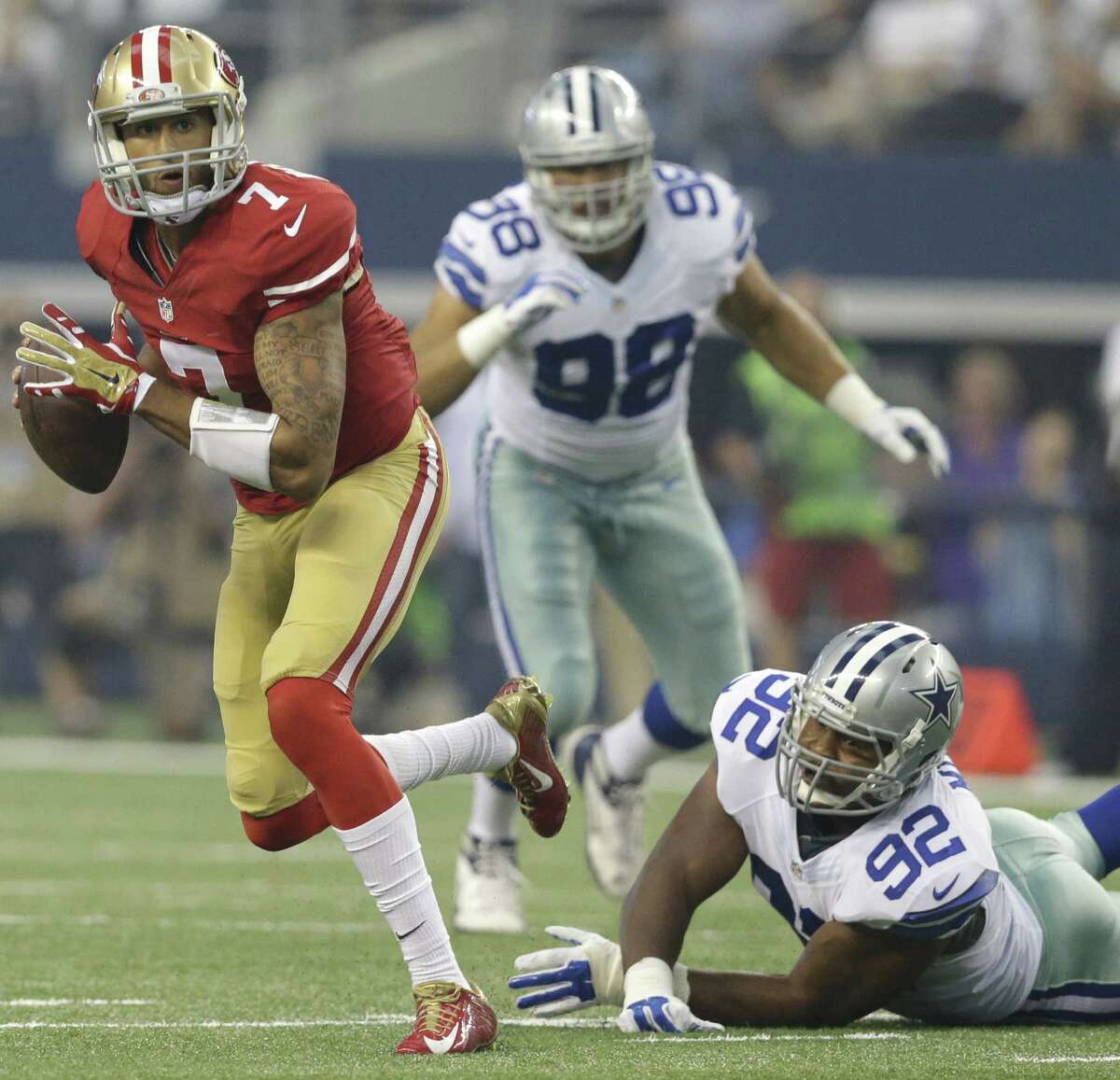 San Francisco 49ers quarterback Colin Kaepernick eludes the Dallas Cowboy defense in the season opener last week. After one bad showing, some fans are expecting the worst this year.