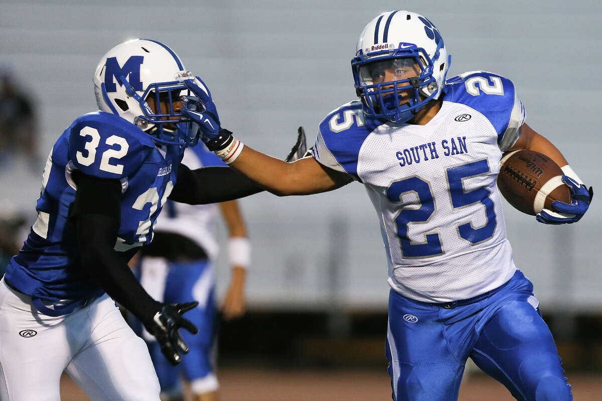 South San's Justin Acosta (right) tries to get past MacArthur's Deandre Frowner during the first half of their game at Comalander Stadium on Friday, Sept. 12, 2014. MARVIN PFEIFFER/ mpfeiffer@express-news.net
