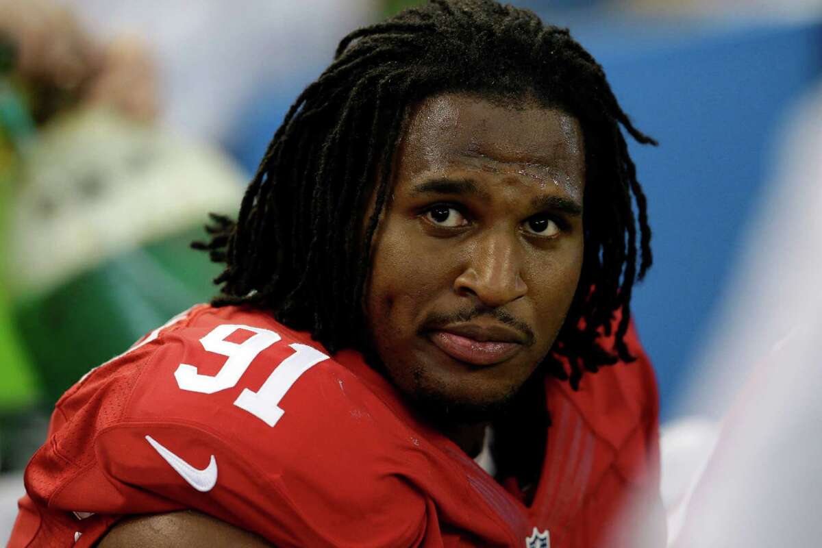 FILE - In this Sept. 7, 2014, file photo, San Francisco 49ers' Ray McDonald sits on the bench during the second half of an NFL football game against the Dallas Cowboys in Arlington, Texas. San Francisco 49ers CEO Jed York said Tuesday, Sept. 9, 2014, that he will let "due process take its course" before deciding whether to discipline Ray McDonald after the defensive tackle was arrested on suspicion of domestic violence. In his first public comments since McDonald's arrest Aug. 31, York told San Francisco's KNBR radio that he will not punish McDonald until he sees "evidence that it should be done or before an entire legal police investigation shows us something." (AP Photo/LM Otero, File)