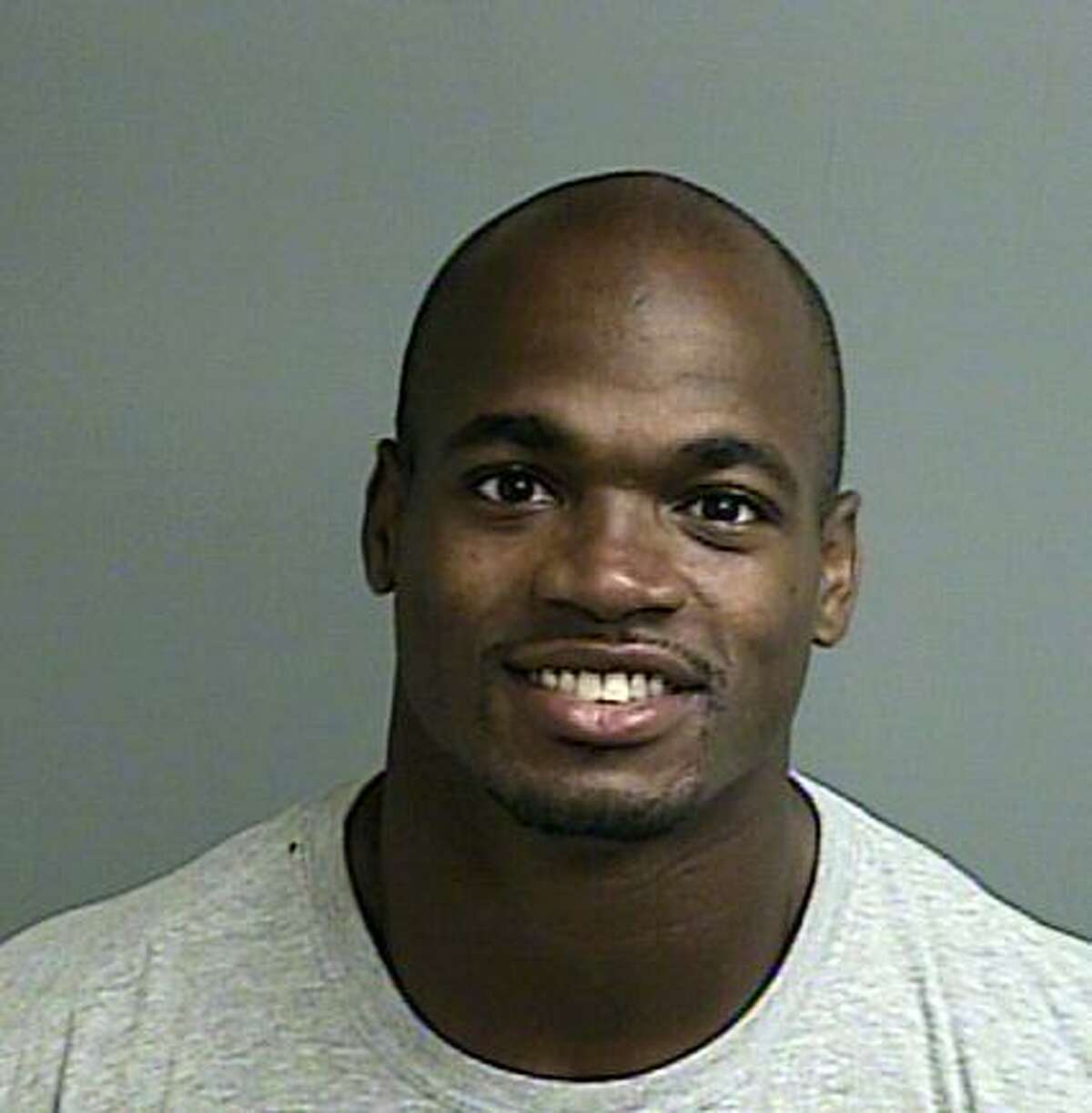 This photo provided by the Montgomery County sheriffâs office shows the booking photo of Adrian Peterson. Peterson was indicted in Texas for using a branch to spank one of his sons and the Minnesota Vikings promptly benched him for their game Sunday, Sept. 14, 2014 against the New England Patriots. (AP Photo/Montgomery County sheriffâs office)