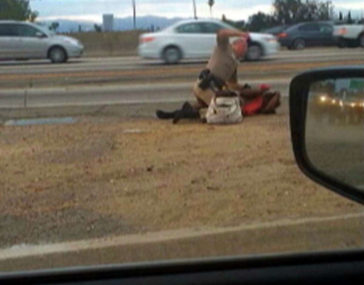 In this July 1, 2014 file image made from video provided by motorist David Diaz, a California Highway Patrol officer straddles a woman while punching her. The incident took place on the shoulder of a Los Angeles freeway. A California Highway Patrol officer videotaped repeatedly punching a woman on the side of a Los Angeles freeway had just pulled her from oncoming traffic and she resisted by pushing him, a patrol investigator said. Investigator Sean Taketa outlined the July 1 incident in a request to search 51-year-old Marlene Pinnock's medical records. The narrative in the search warrant was made public in court documents last month and is the first detailed account of the incident since a passing driver released cellphone video that went viral.Latest from AP:  Ms. Pinnock resisted by pushing the officer," the documents say. Andrew then straddled her on the ground as Pinnock resisted by "kicking her legs, grabbing the officer's uniform and twisting her body," the investigator wrote. Andrew "struck her in the upper torso and head several times with a closed right fist," the records say.