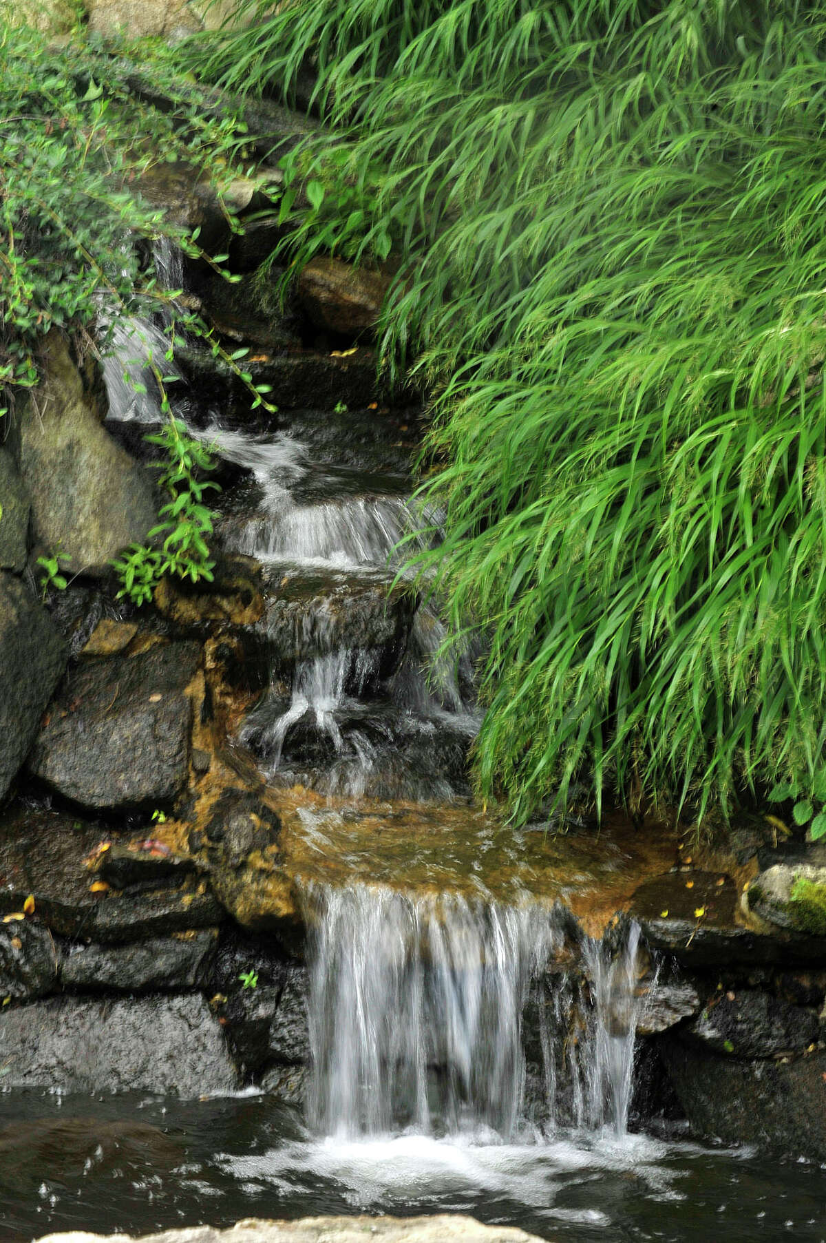 A man-made waterfall is seen at Exquisite Environments in Stamford, Conn., on Sunday, Sept. 14, 2014.