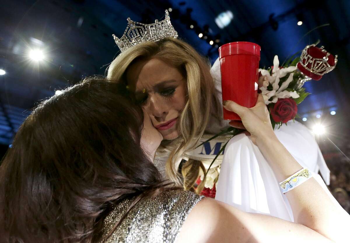 Miss New York Kira Kazantsev, right, gets a kiss from her mother, Julia Kazantsev, after Kira Kazantsev was crowned Miss America 2015 during the Miss America 2015 pageant, Sunday, Sept. 14, 2014, in Atlantic City, N.J. (AP Photo/Julio Cortez)