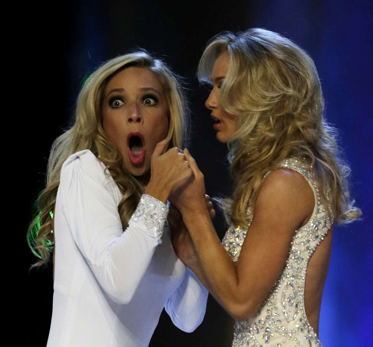 Miss New York Kira Kazantsev, left, gasps after she was named Miss America 2015 as she holds hands with Miss Virginia Courtney Paige Garrett during the Miss America 2015 pageant, Sunday, Sept. 14, 2014, in Atlantic City, N.J. (AP Photo/Julio Cortez)