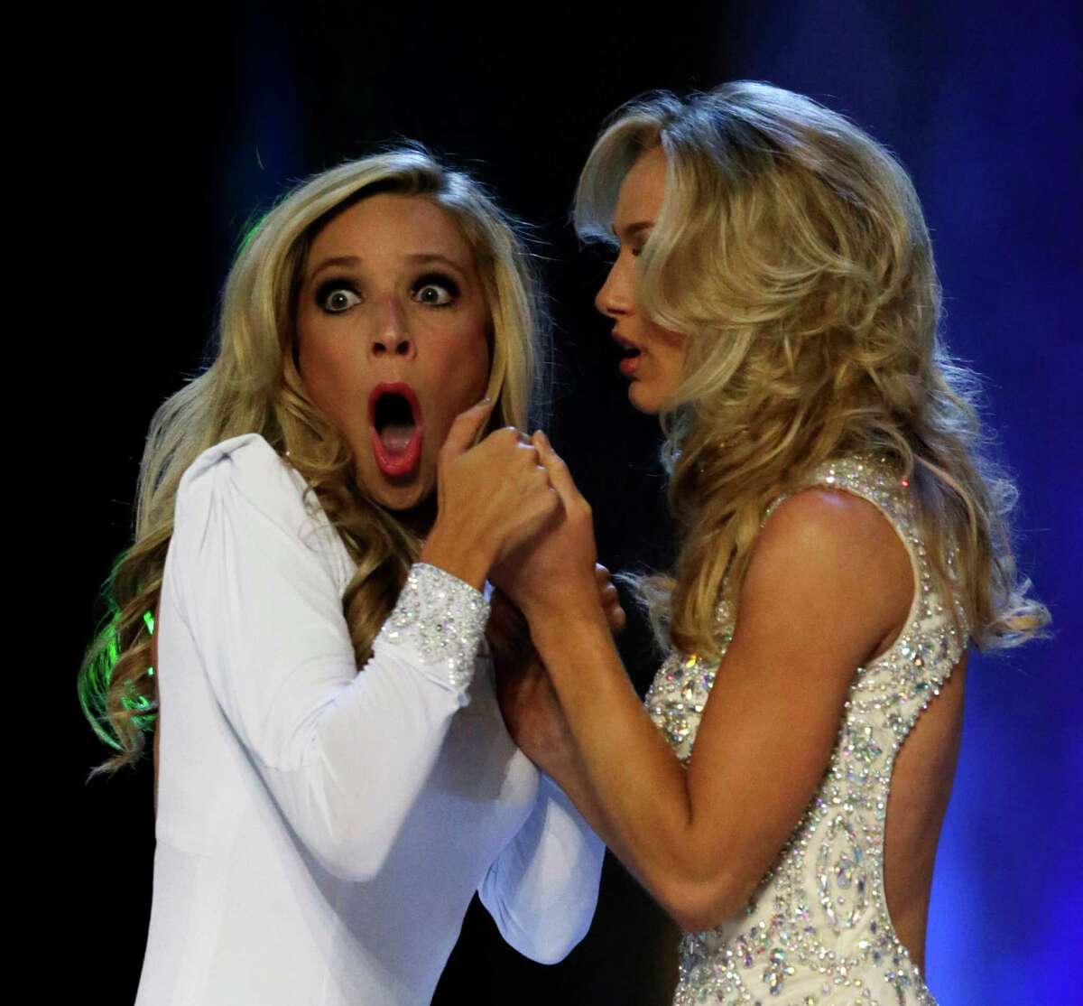Miss New York Kira Kazantsev, left, gasps after she was named Miss America 2015 as she holds hands with Miss Virginia Courtney Paige Garrett during the Miss America 2015 pageant, Sunday, Sept. 14, 2014, in Atlantic City, N.J.