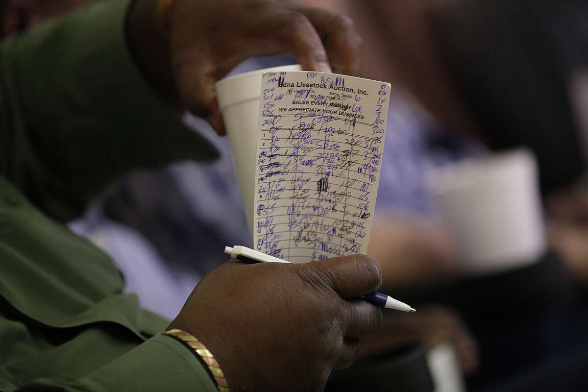 A buyer keeps a tally while buying stock during the weekly auction at the Karnes County Livestock Exchange in Kenedy, Texas, Thursday, Sept. 11, 2014. With the beef prices at a high, ranchers affected by the drought are selling their stock.