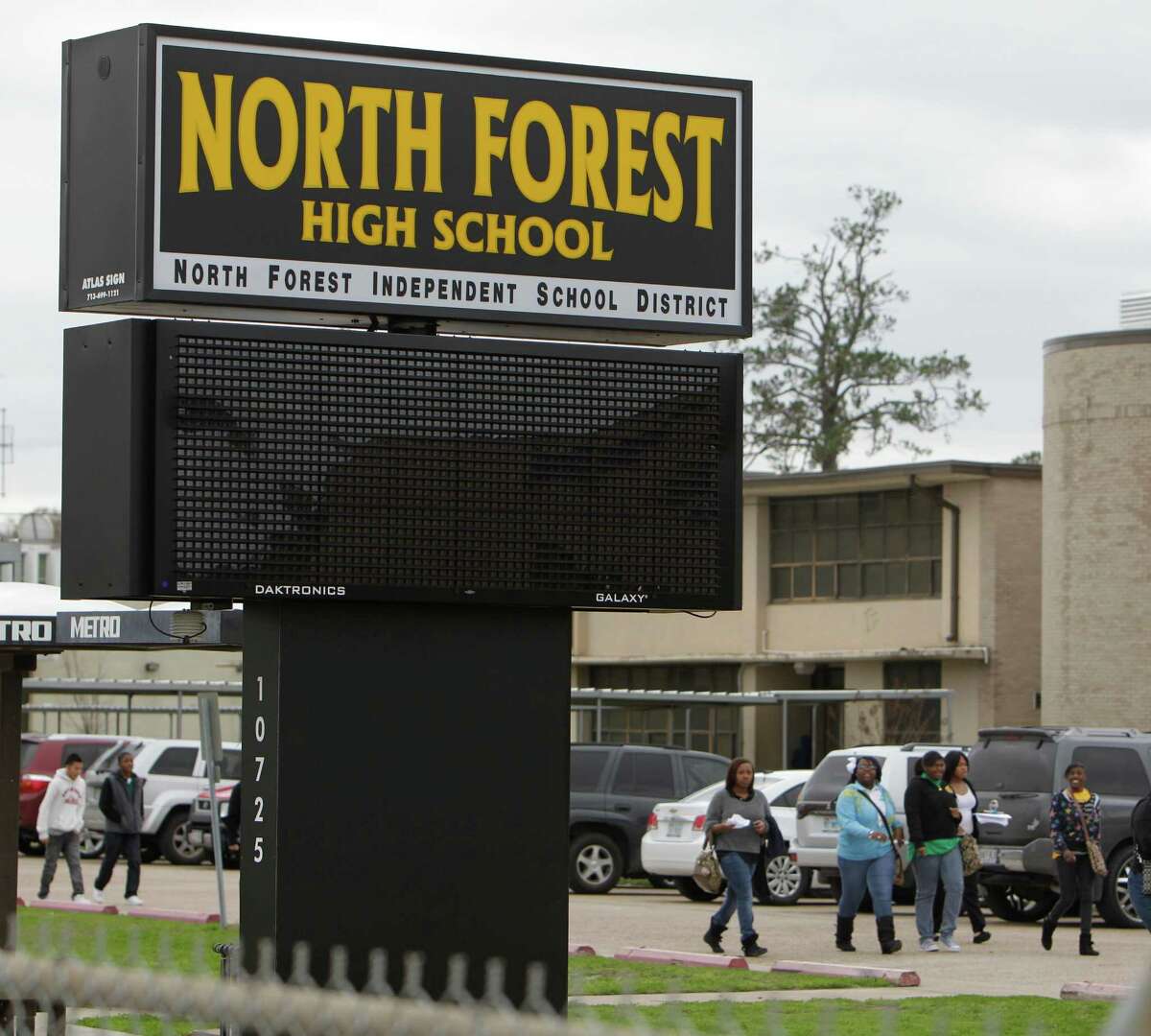 HISD is seeking more state funds to rebuild North Forest High School, shown here during a shooting investigation in 2012. HISD annexed the North Forest school district 14 months ago. ( Melissa Phillip / Houston Chronicle )