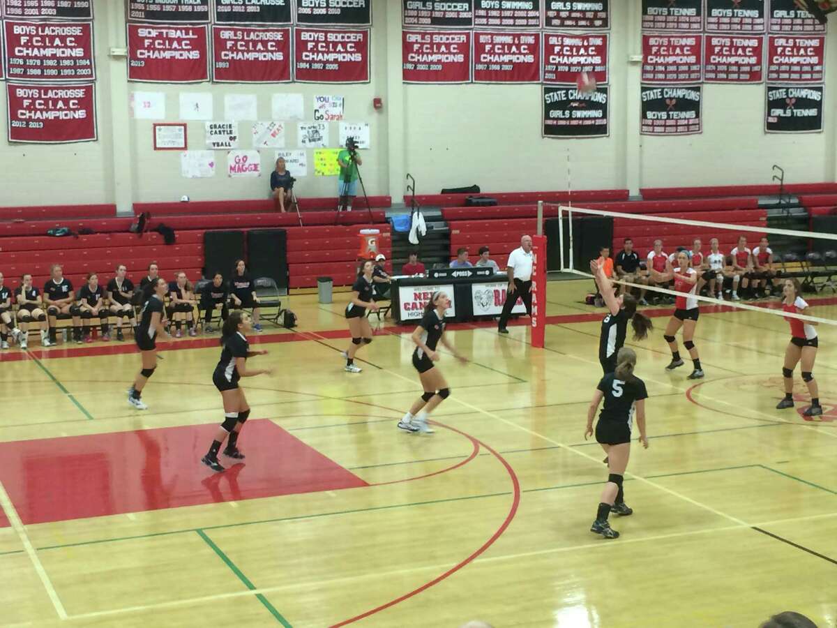 New Canaan's Gracie Castle bumps the ball to a teammate during the fourth set of the Rams' game agianst Fairfield Warde on Monday, September 15, at New Canaan High School.