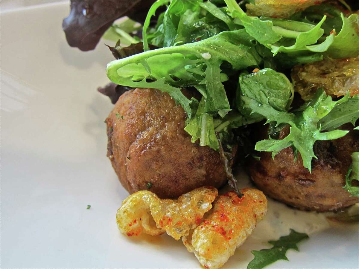 Fried boudin balls with remoulade, greens and cracklinsat Common Bond Cafe & Bakery.