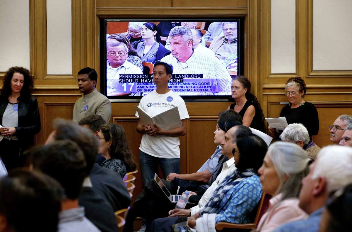 People line up for a chance to speak as the San Francisco planning commission hears public comment to Supervisor David Chiu's proposed Airbnb legislation at their weekly meeting in City Hall on Thursday August 7, 2014, in San Francisco, Calif.