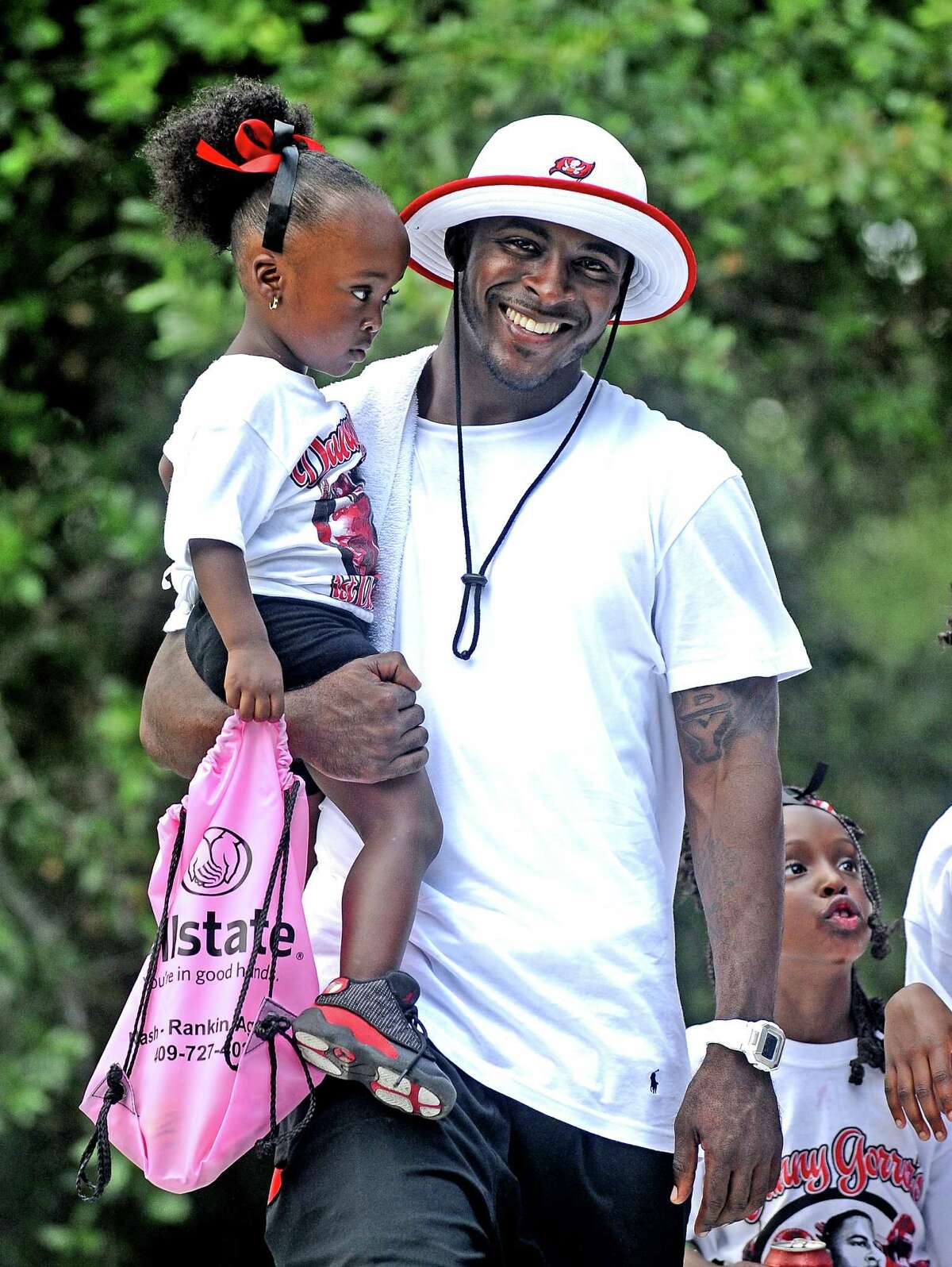 Danny Gorrer holds his two-year-old daughter Daniya Gorrer leaving the stage at the Danny Gorrer Annual Cookout at Barbara Jacket Park in Port Arthur on June 15, 2013. Photo taken: Randy Edwards/The Enterprise