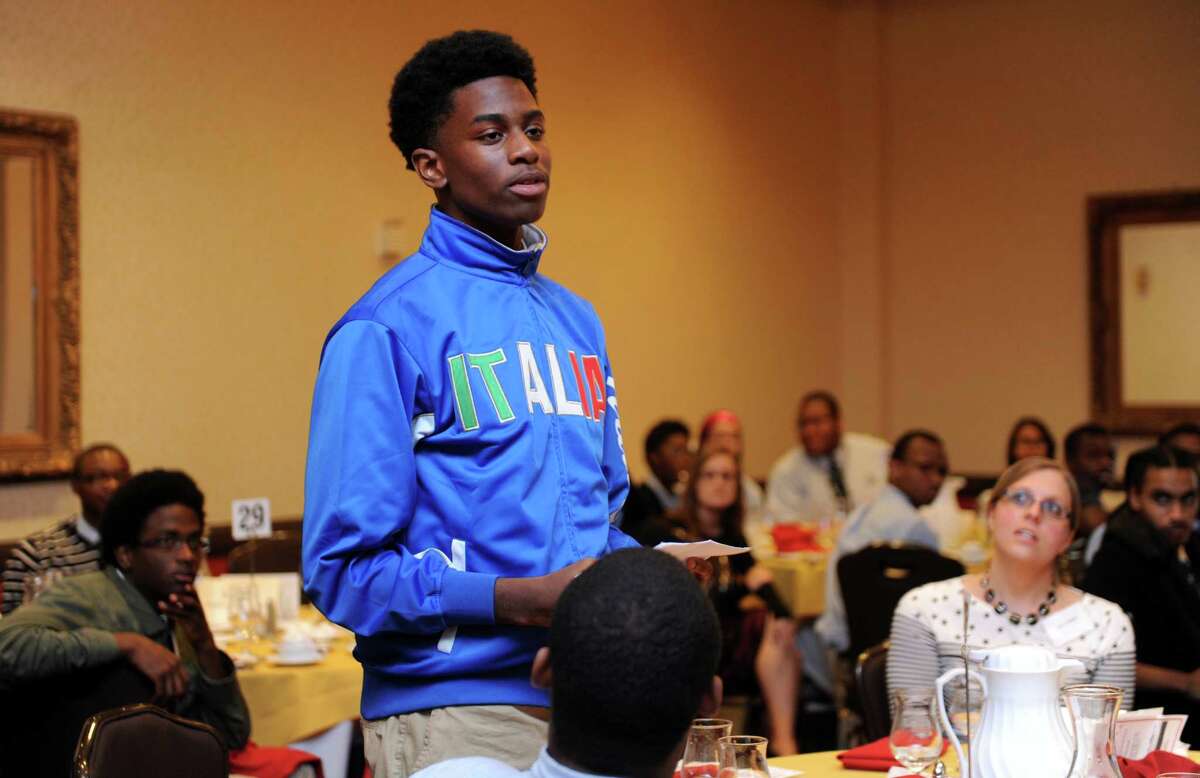 Christopher Scott, 16, of Bridgeport, a senior at Amistad Academy in New Haven, asks John W. Marshall, son of Thurgood Marshall, if he felt obligated to practice law because of his father's legacy during a Bridgeport Public Education Fund program Wednesday, Sept. 17, 2014, at the Holiday Inn in Bridgeport, Conn.