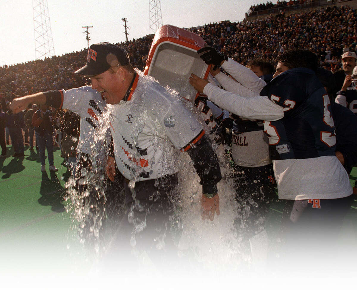 Roosevelt coach Bryan Dausin is drenched after his team beat Flower Mound Marcus for the 1995 Class 5A Division II title.