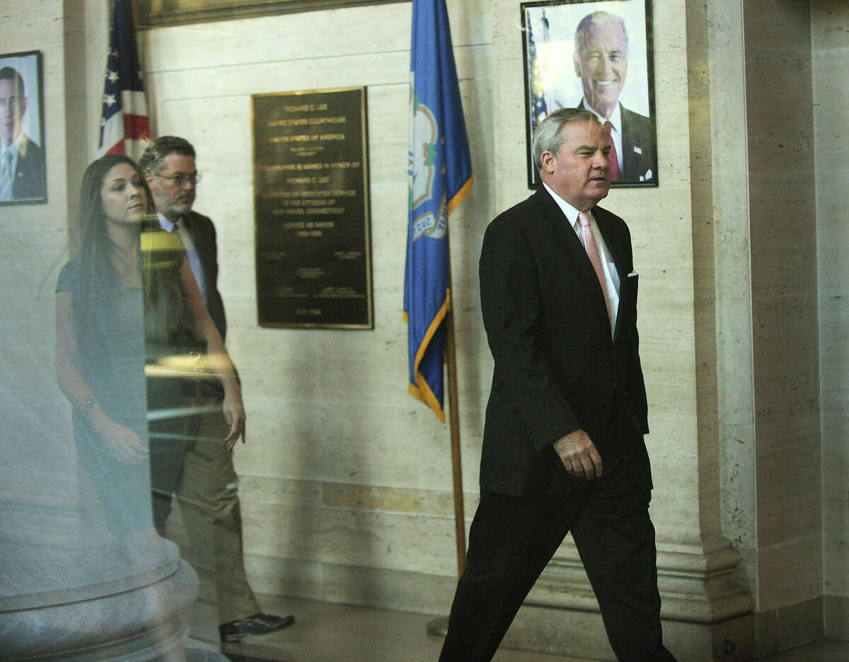 Former Governor John Rowland walks in to Federal Court in New Haven, Conn. on Thursday, September 18, 2014. Rowland faces seven charges of violating federal election laws.