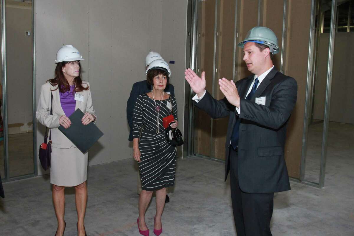 Daniel Moreno, right, leading a tour of the 35th floor at 1201 Louisiana Street, which will be the new home of the Petroleum Club. (For the Chronicle/Gary Fountain, September 18, 2014)