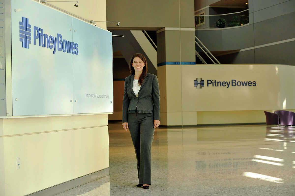 Lila Snyder poses for a photograph in the lobby of Pitney Bowes in Stamford, Conn., on Thursday, Sept. 18, 2014. Snyder is the president of document messaging technologies.