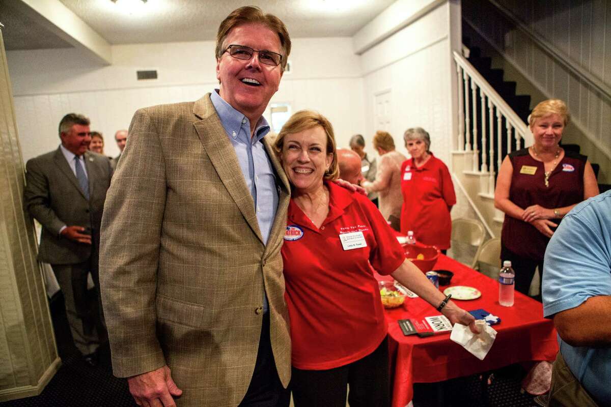 Senator Dan Patrick poses for a photo with supporter, Linda Flower, right, during a Tea Party Republican Women meeting at the Greenwood Forest Residents Club, Tuesday, Sept. 9, 2014, in Houston. (Cody Duty / Houston Chronicle)