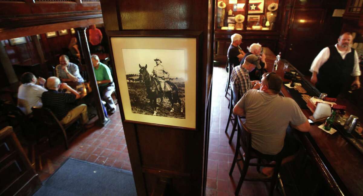 Teddy Roosevelt memorabilia is seen Wednesday Sept. 17, 2014 in the Menger Hotel bar, where it is said Roosevelt recruited volunteers for his Rough Riders.