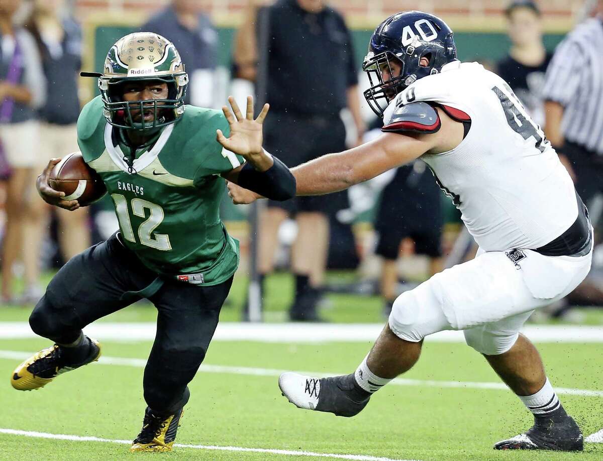 DeSoto's Jaylin Nelson looks for running room around Steele's Zach Edwards during first half action Thursday Sept. 18, 2014 at Baylor University's McLane Stadium in Waco, Tx.