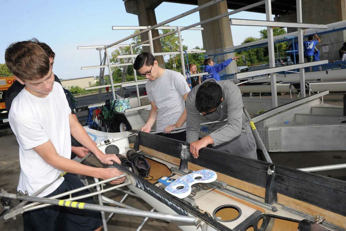 Left, to right, Michael Prappulos, Euan Walker, Joey Illuzzi and Craig Rosen of the North Jersey crew team work on their quad boat during the 28th Head of the Hudson Regatta on Saturday Sept. 20, 2014 in Albany, N.Y. (Michael P. Farrell/Times Union)