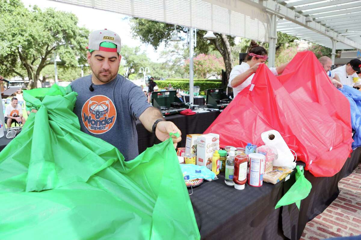 Chef Kevin Naderi reveals ingredients, limited food items found in emergency kits, during the second annual Ready Houston Preparedness Kit Chef's Challenge at Market Square on Saturday, Sept. 20, 2014, in Houston. The event was hosted by The City of Houston Mayor's Office of Public Safety and Homeland Security, and Houston Community Preparedness Collaborative.