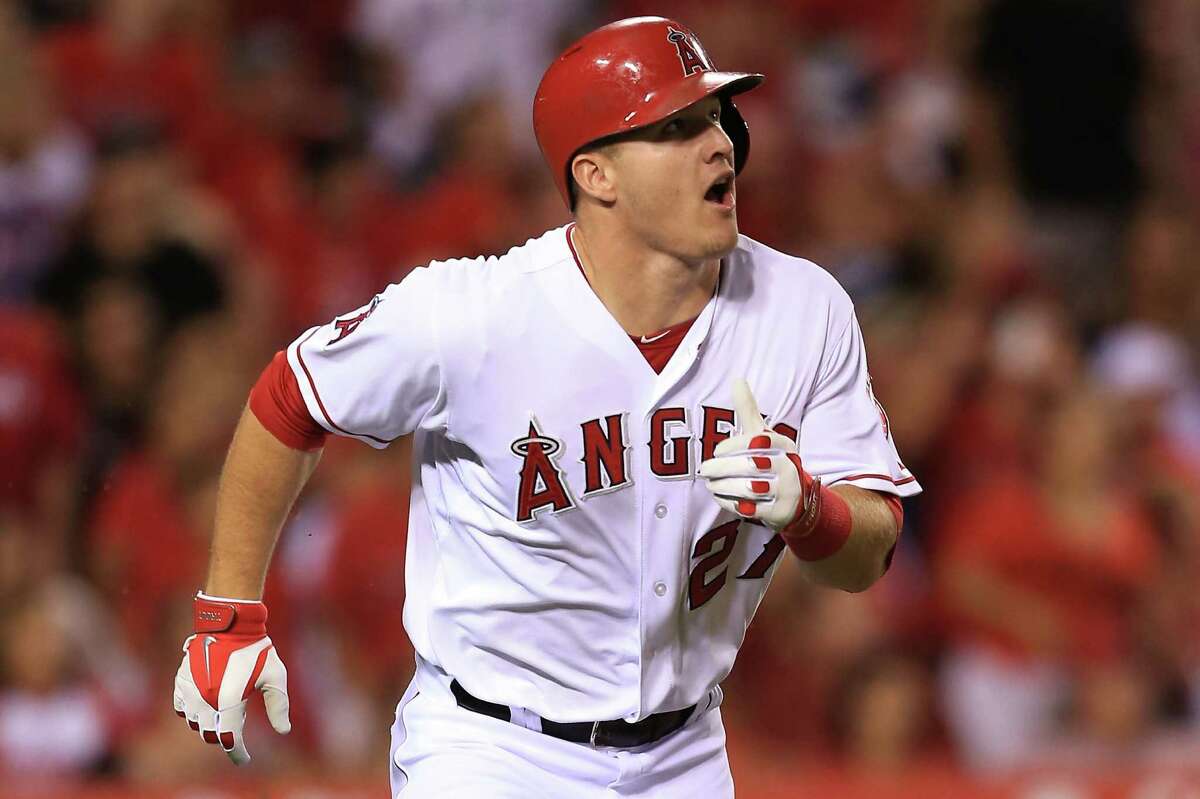 The Angels' Mike Trout watches his hit to right-center field go for a triple in the fifth inning.