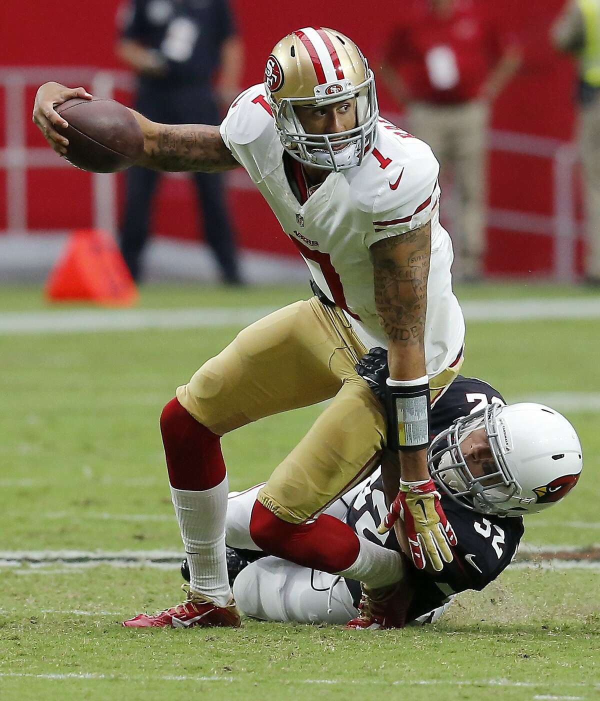 San Francisco 49ers quarterback Colin Kaepernick (7) is tackled by