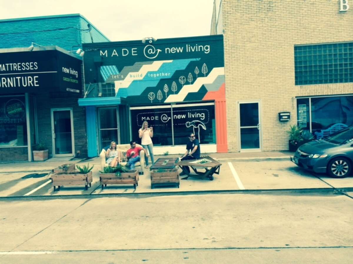 From PARK(ing) Day 2014: In the Rice Village, New Living employees hang out in a temporary micro-park, or parklet on Kirby.