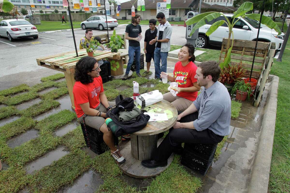 From PARK(ing) Day 2014: University of Houston architecture students enjoy the temporary transformation of a metered parking space on campus. (For more PARK(ing) Day photos, scroll through the gallery.)