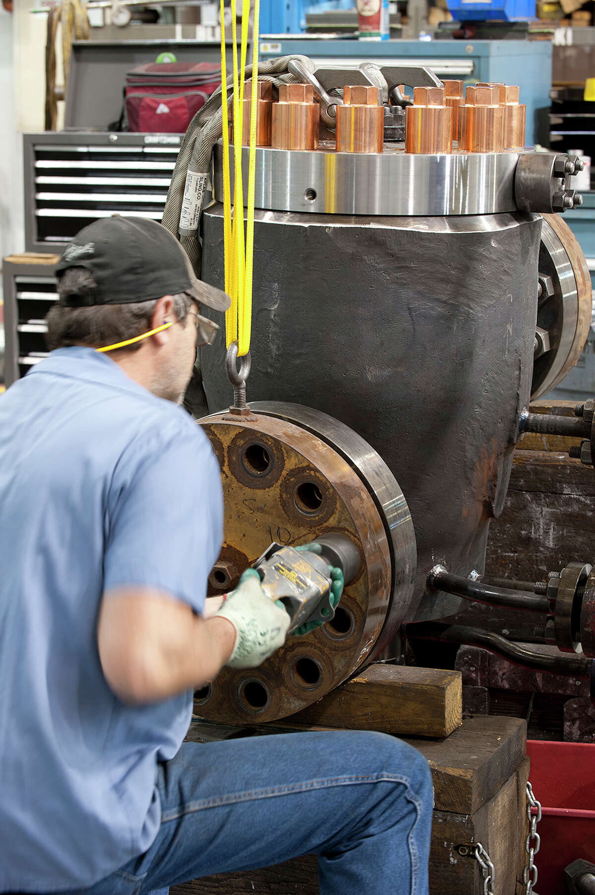 A Dresser-Rand worker disassembles a Gimpel valve.