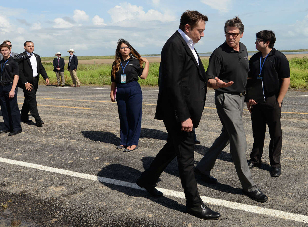 Elon Musk and Texas Gov. Rick Perry meet prior to the SpaceX groundbreaking Monday.