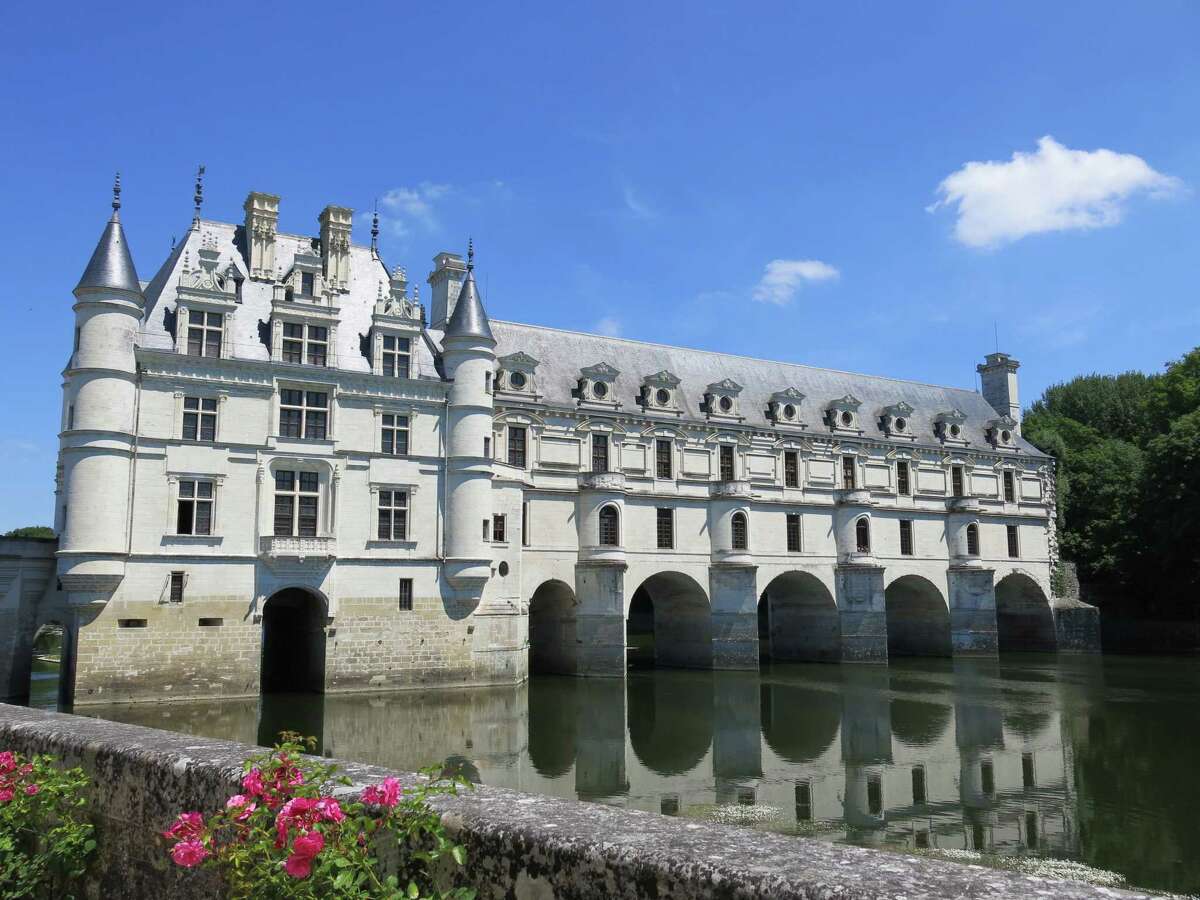 Chateau de Chenonceau, spanning the River Cher, is near the village of Chenonceaux, France. The Chateau de Chenonceau has not only been refurnished, but the wing built spanning the river Cher has been turned into a gallery.