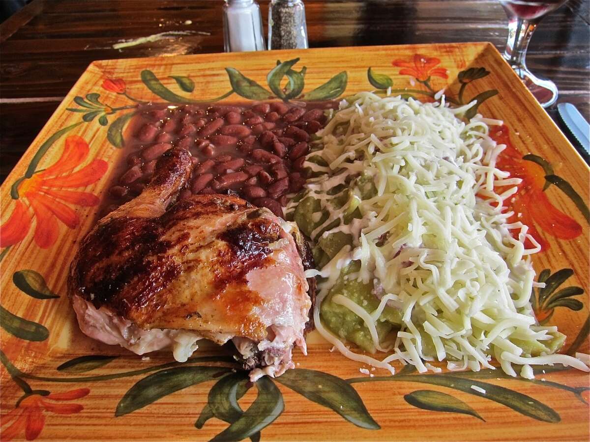 Peruvian chicken with chilaquiles verdes plate at Pollo Bravo