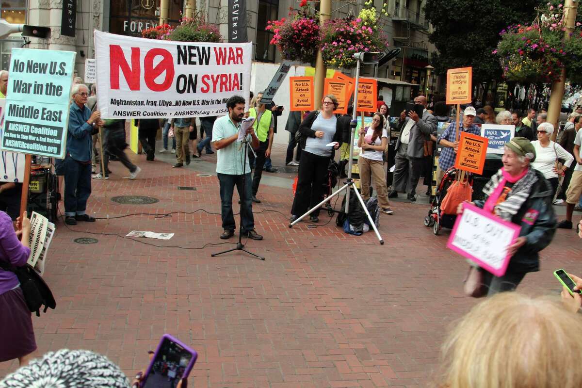 Frank Lara, an organizer with the ANSWER Coalition, rallies the crowd at an anti-war demonstration in downtown San Francisco on Wednesday.