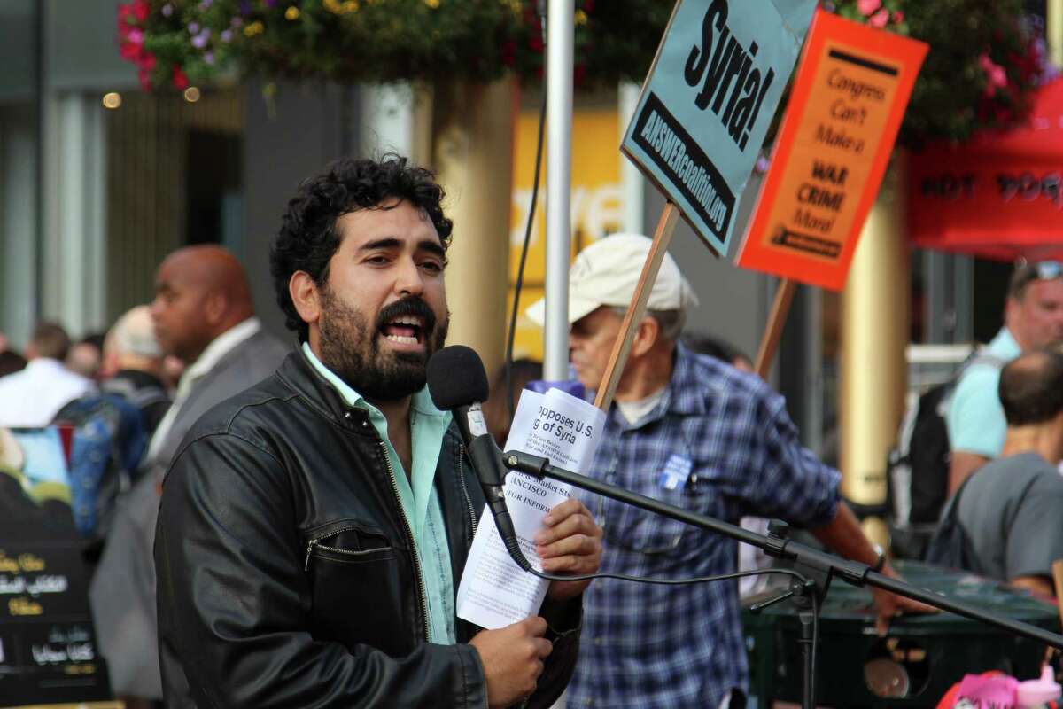 Frank Lara, an organizer with the ANSWER Coalition, rallies protesters at an anti-war demonstration in downtown San Francisco on Wednesday.